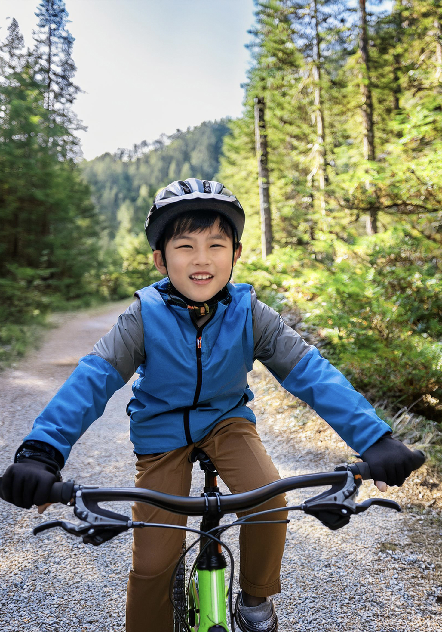 January Impact Grants Update: young boy riding a mountain bike