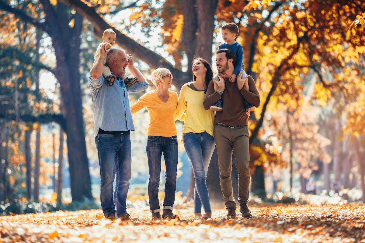Multl generation family in autumn park having fun