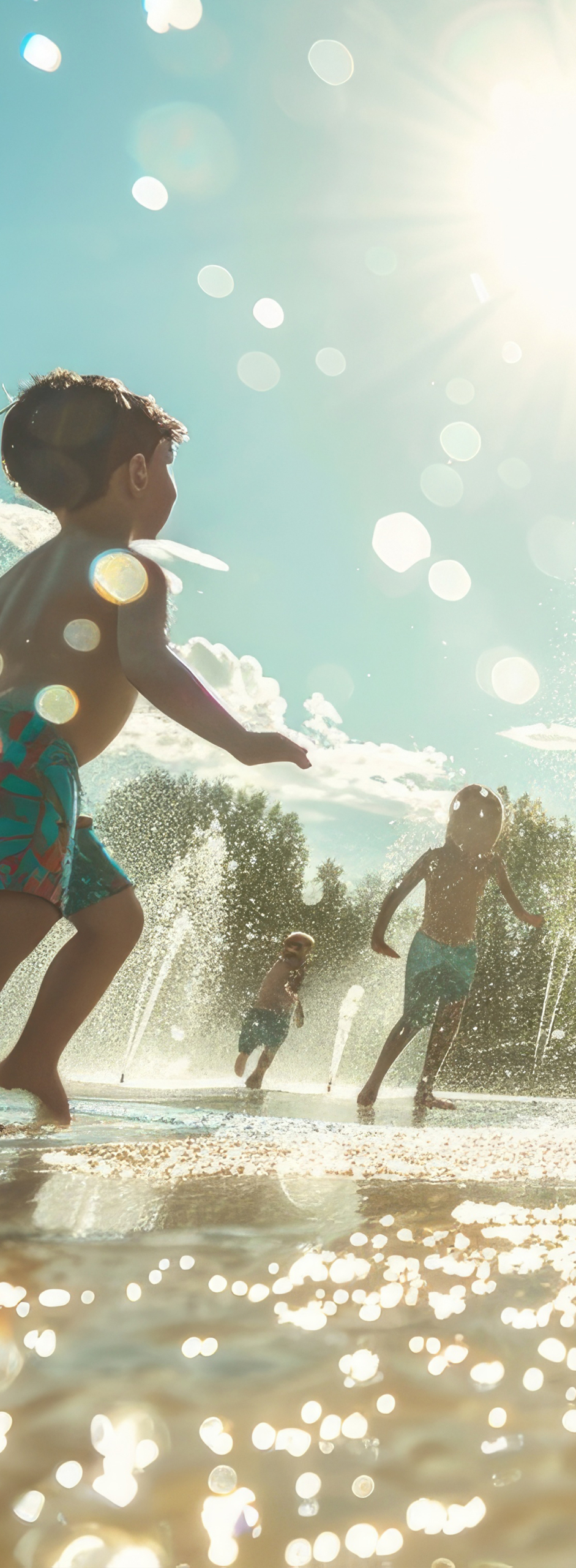 splash-pad Image for Health and Human Services Category: young girl with Downs Syndrome smiling while holding up her hand which is covered in finger paints